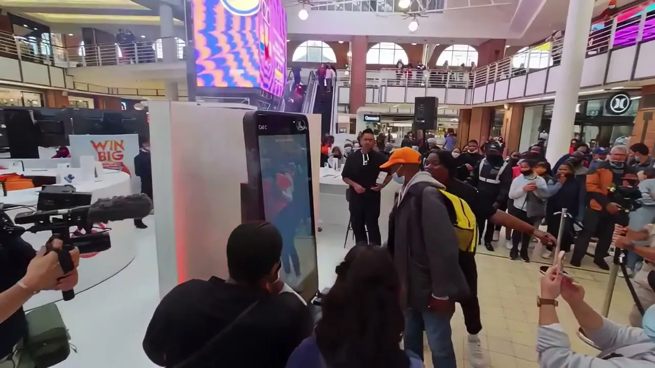 A crowd gathered around a Cell C activation in a shopping mall