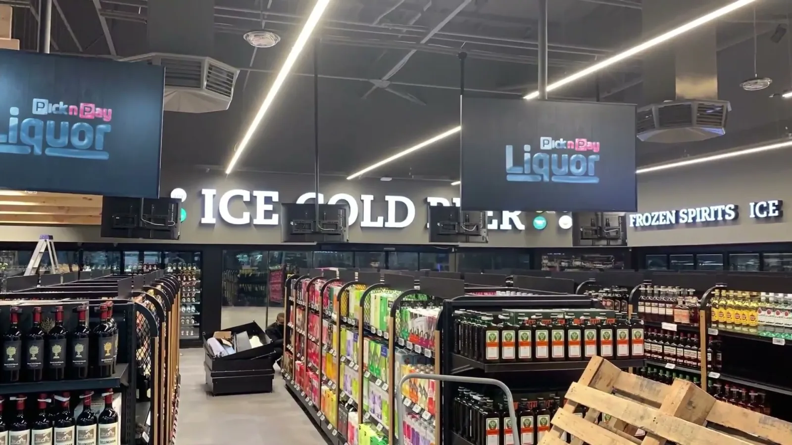 Screens above the aisles of a Pick n Pay Liquor store