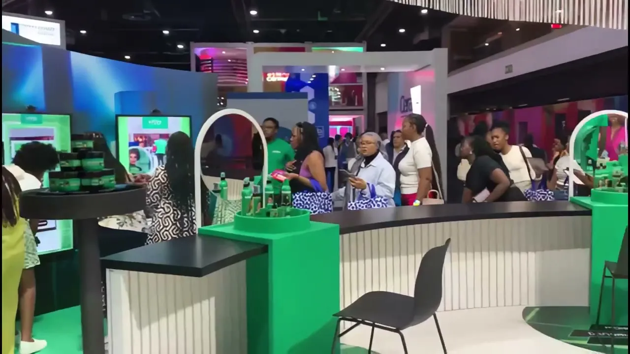 Shoppers at a green Sofnfree activation stand