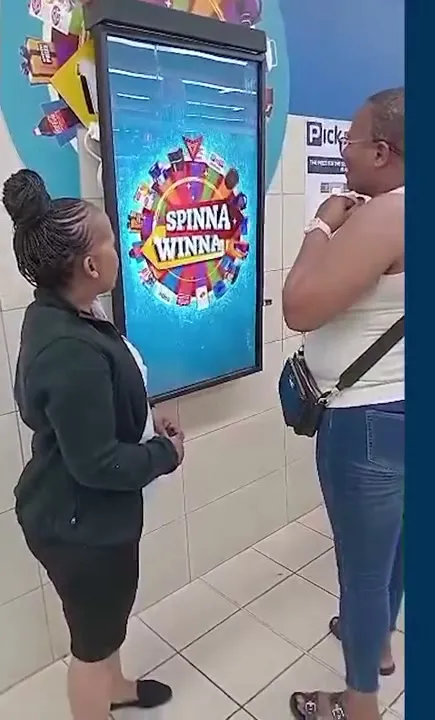 A shopper at a Spinna Winna kiosk in a Pick n Pay store